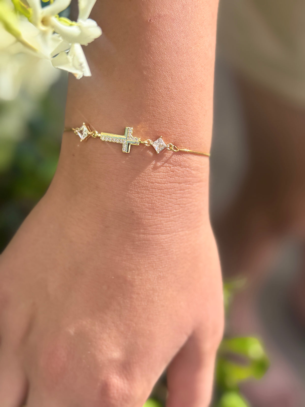 Cubic Zirconia Crystal Gold Plated Cross Bracelet paired with a 14KT Gold Snake Bolo Chain Made in The USA