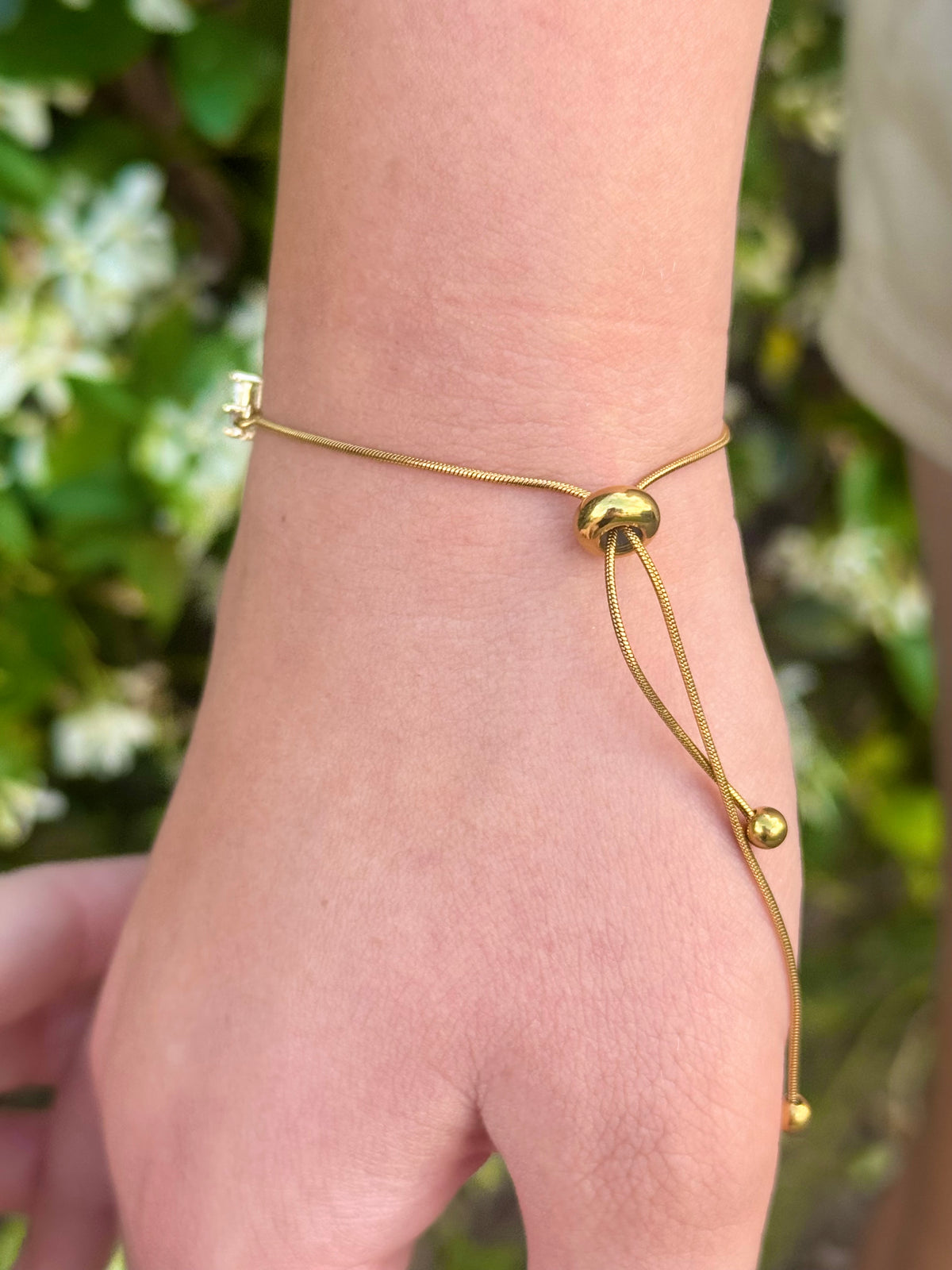 Cubic Zirconia Crystal Gold Plated Cross Bracelet paired with a 14KT Gold Snake Bolo Chain Made in The USA